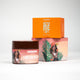 Shea body butter with focus on orange packaging featuring a tropical-dressed girl illustration, ideal for glowing skin.