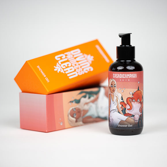 Brown apricot shower gel bottle with pump in focus, with a matching open box of the product in the background.