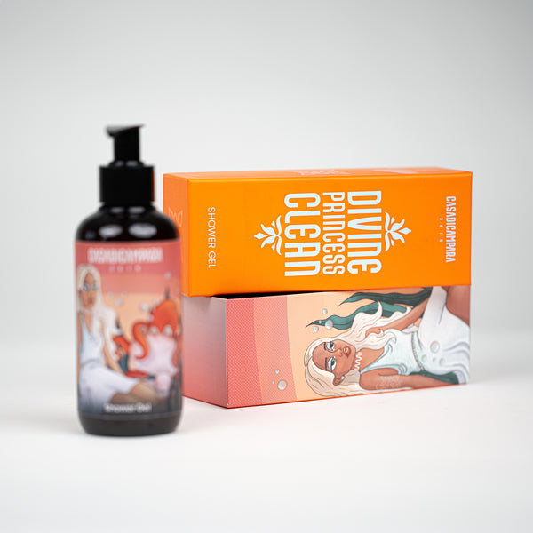 Shower gel bottle with focus on orange product package lying in the background, refreshing body care essentials.