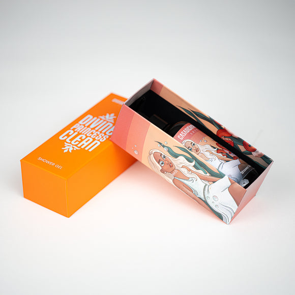 Bottle of apricot shower gel featuring a girl illustration, gently leaning against the lid of an orange box.
