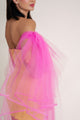 Woman in bright yellow Casa Di Campara dress with pink tulle overlay, posing with hand on hip. Elegant yellow dress.