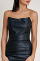 Close-up of the black satin fabric highlighting sheen and texture of the dress.