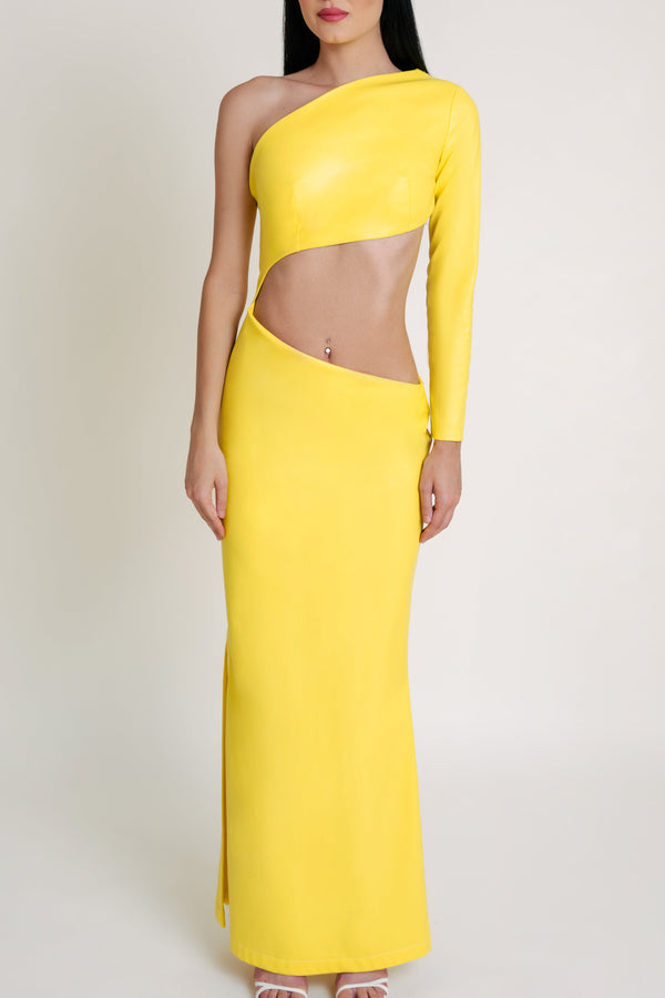 Woman in elegant yellow Casa Di Campara dress with long sleeve, asymmetrical waist cutout, and high side slit.
