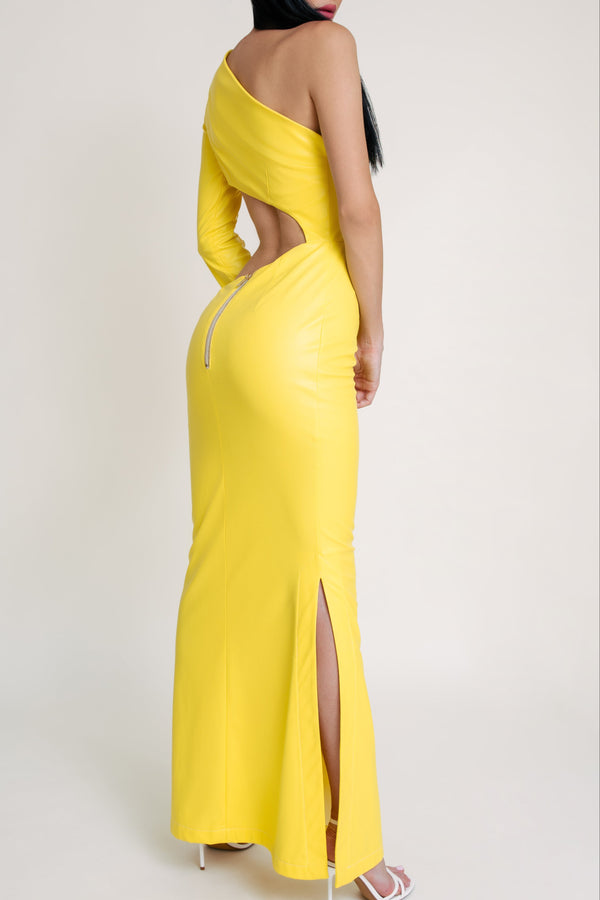 Back view of a yellow one-sleeve cut-out gown with side slit and exposed zipper detail.