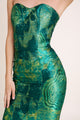 Close-up of jacquard green luxurious fabric texture on an elegant emerald green dress.