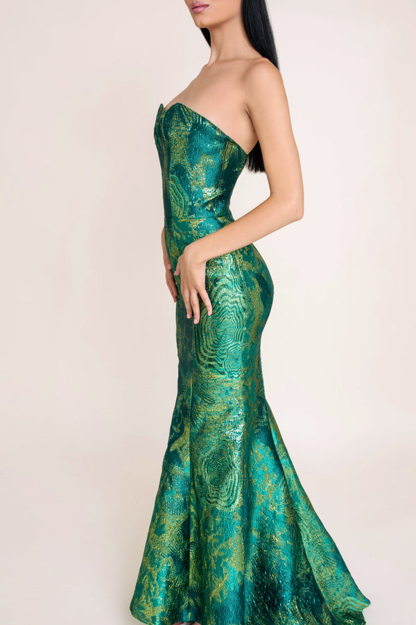 Side view of emerald green dress with fitted waist and jacquard detail - ideal elegant green dress for summer.