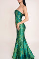 Side view of emerald green dress with fitted waist and jacquard detail - ideal elegant green dress for summer.