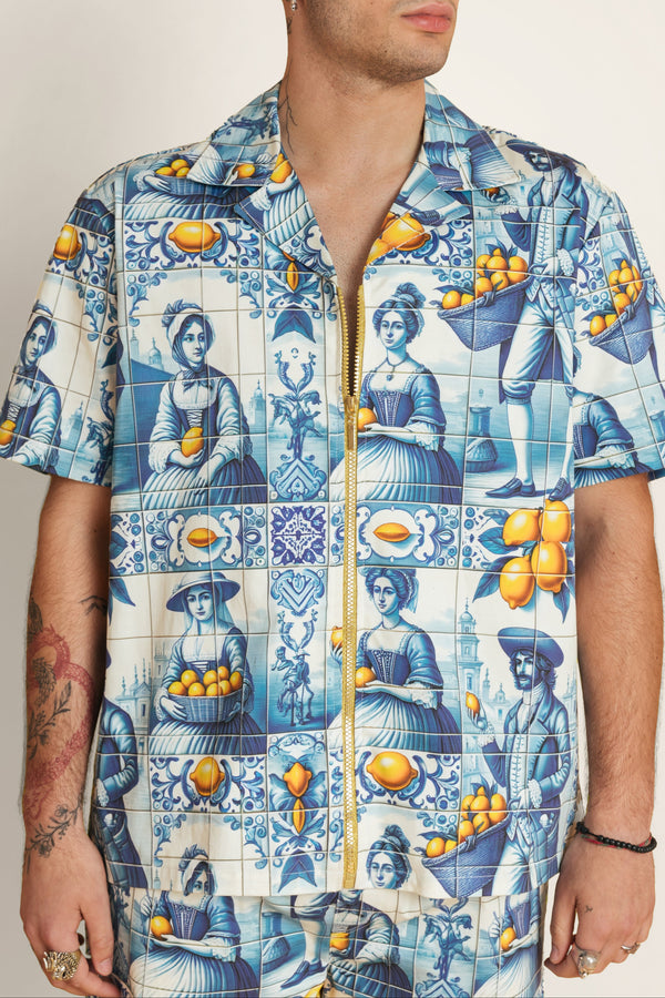 Back view of unisex cotton shirt showcasing continuous tile motif and relaxed cut - modern summer shirt perfect with summer shorts.