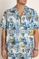 Back view of unisex cotton shirt showcasing continuous tile motif and relaxed cut - modern summer shirt perfect with summer shorts.