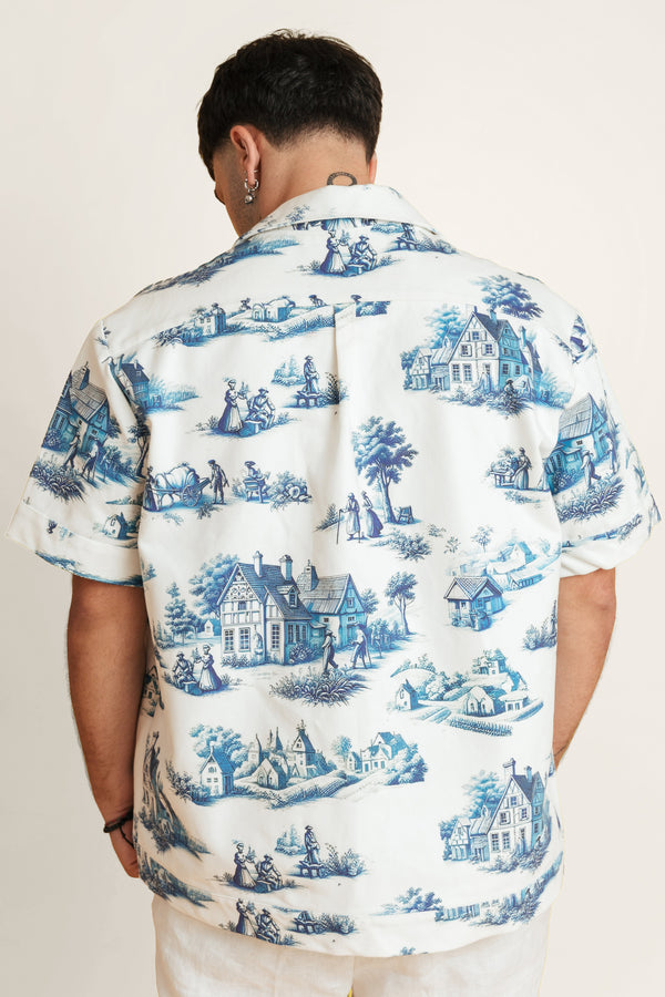 Back of zip‑up cotton shirt featuring blue-and-white tile print for both men and women.