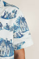Detailed shot of a soft cotton shirt featuring bold blue details - great match with white shorts or trousers.