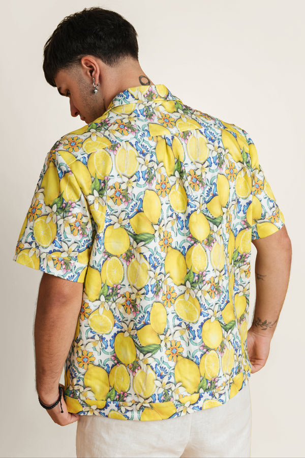 Back view of lemon-print summer shirt - unisex zip-up shirt in citrus tones, great for pairing with summer shorts.