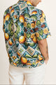 Back view of unisex summer shirt - relaxed fit, easy to pair with shorts or a crop top vibe.