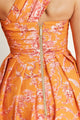 Close-up view of the back zipper feature on the Sintra Magic dress, showcasing the elegant gold hardware and vibrant floral print.