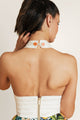 Back detail of a summer mini dress with halter neckline and zipper - elegant lemonade dress perfect for vacation.