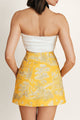Back view of a high-waisted yellow skirt, breathable summer skirt ideal for seaside lunches or sunny getaway.