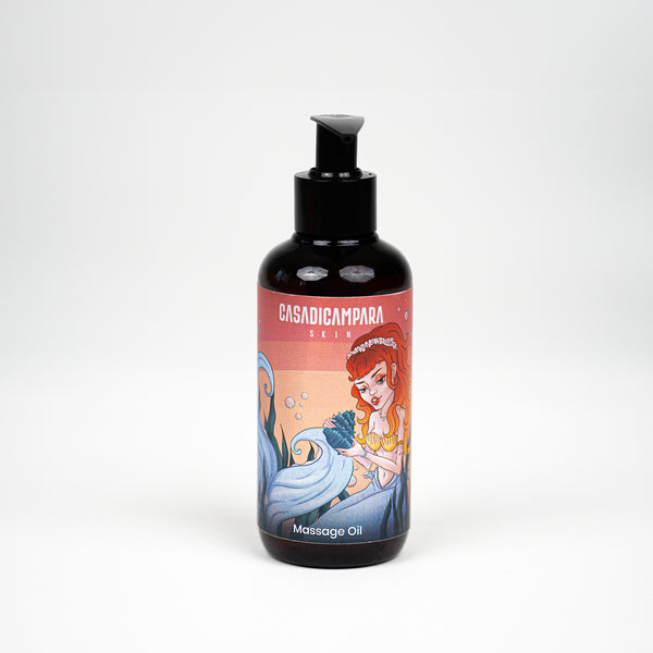 Brown bottle of Rub Me Good massage oil with a pump, featuring packaging with the Casa Di Campara brand name and a mermaid illustration.