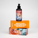 Rub Me Good massage oil bottle with mermaid illustration and pump, on top of of orange packaging box.