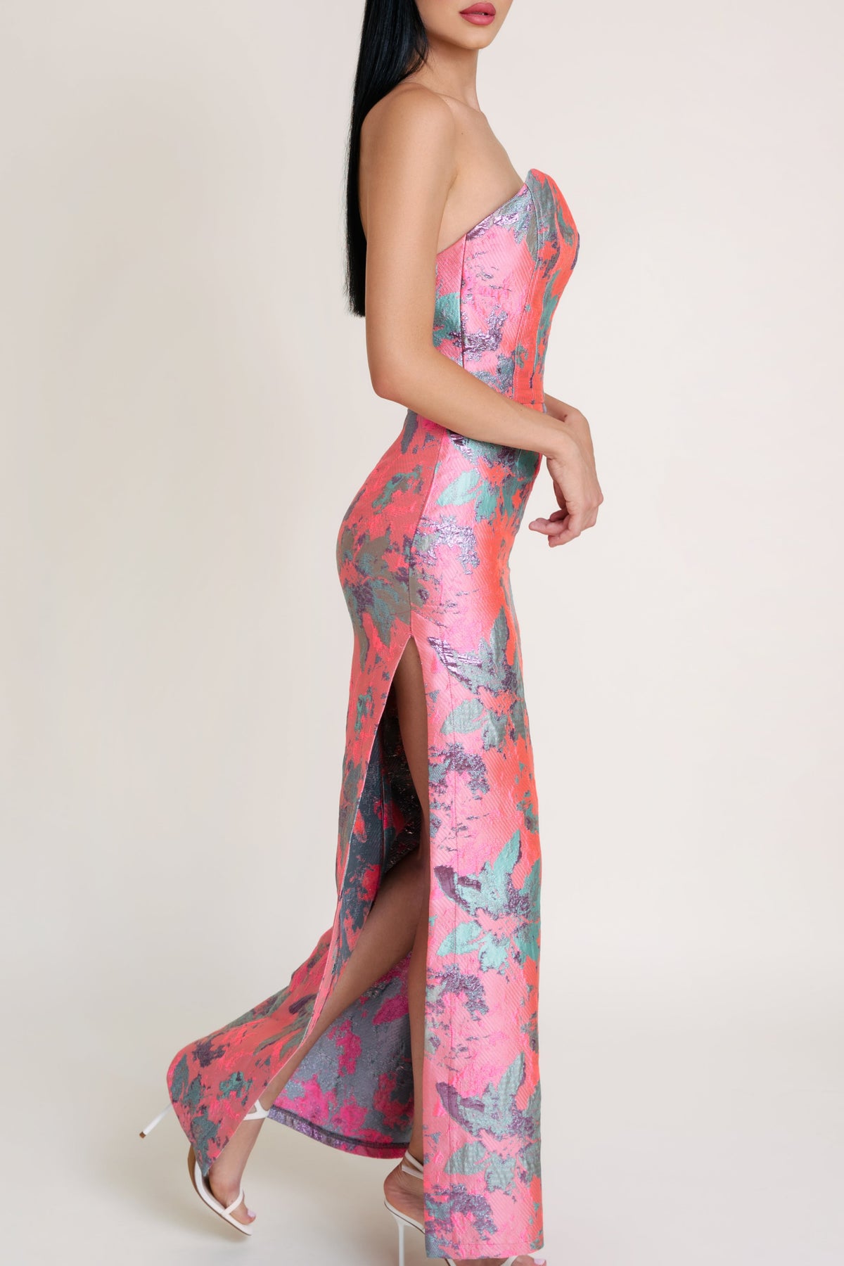 Side view of pink jacquard dress featuring a fitted bodice and flowing long dress silhouette for an effortlessly elegant summer look.