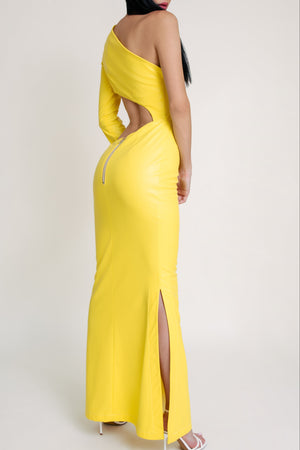 Back view of a yellow one-sleeve cut-out gown with side slit and exposed zipper detail.