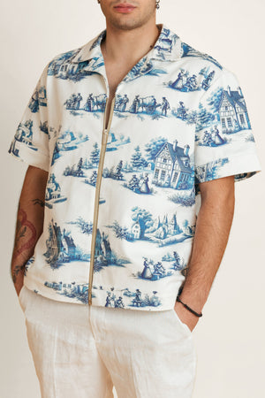 Unisex shirt with classic blue and white print featuring detailed geometric and floral patterns.