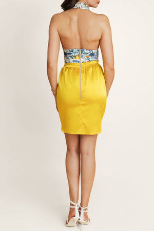 Back view of a tight two tone dress with yellow skirt and striped top – a playful summer mini dress for sunny escapes.