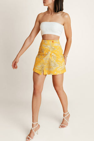Front view of Golden Porto yellow skirt, airy summer skirt paired with crop top - vibrant outfit for beach or brunch. 